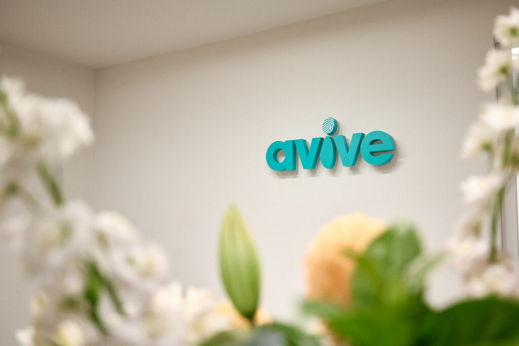Avive logo on the reception wall at Avive Clinic Melbourne